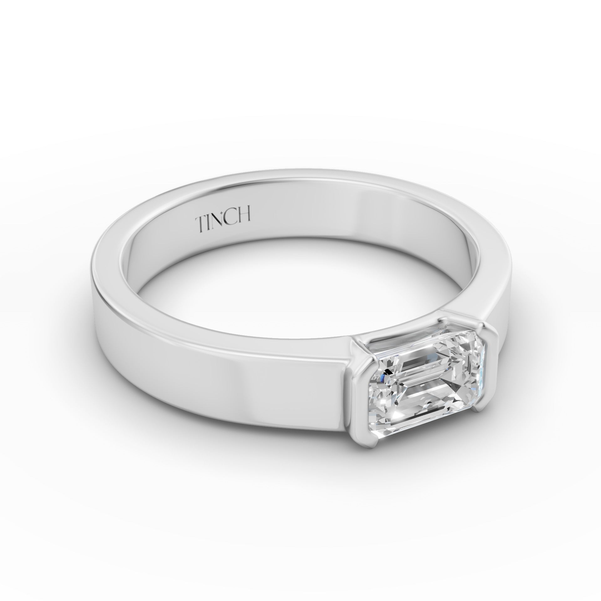 East-west emerald solitaire ring band detail