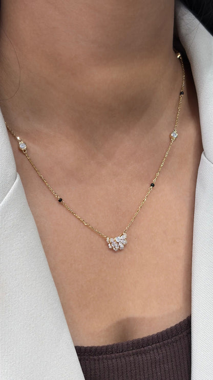 Half Flora diamond station chain pendant, close-up of floral detail