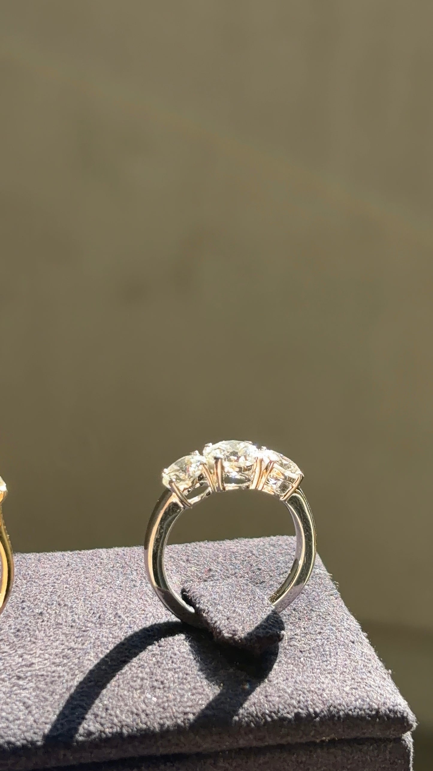 Three Stone Round Solitaire Ring